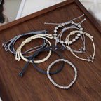 Set de 7 Pulseras Trenzadas Bohemias Vintage — Estilo Libre y Elegante para Toda Ocasión